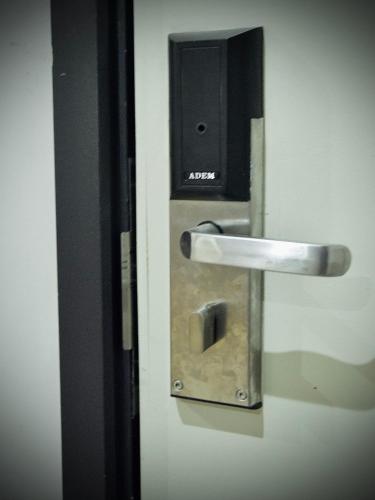 a door with a metal door handle and a door at G5 HOTEL AND SERVICED APARTMENT in Johor Bahru