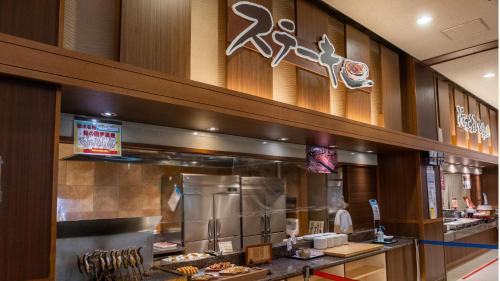 a fast food restaurant with a counter with food at Kinugawa Hotel Mikazuki in Nikko