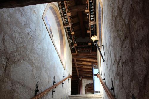 an empty hallway in a building with a spiral staircase at Kemerli Konak Boutique Hotel in Kérynia