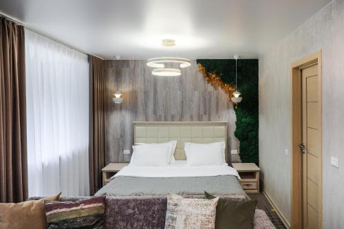 Aurora Park Hotel tesisinde bir odada yatak veya yataklar