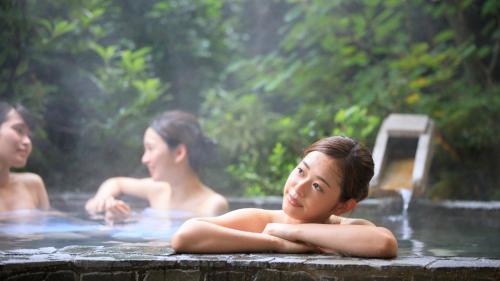 a group of people in a swimming pool at Kinugawa Hotel Mikazuki in Nikko