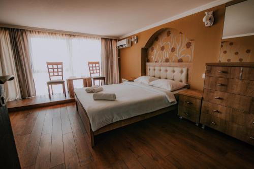Postel nebo postele na pokoji v ubytování Orbi Residence Hotel Official