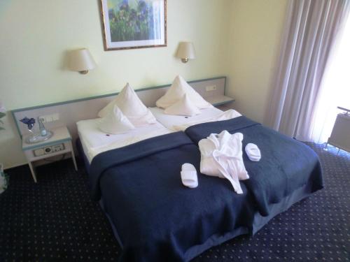
Ein Bett oder Betten in einem Zimmer der Unterkunft Hotel Nordic

