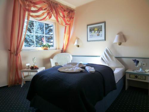 Postel nebo postele na pokoji v ubytování Hotel Nordic