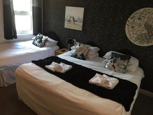 Llit o llits en una habitació de The Victoria Hotel