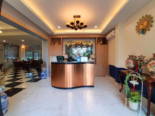 a lobby of a hotel with a reception desk at USABAI Riverside Boutique Hotel in Chanthaburi