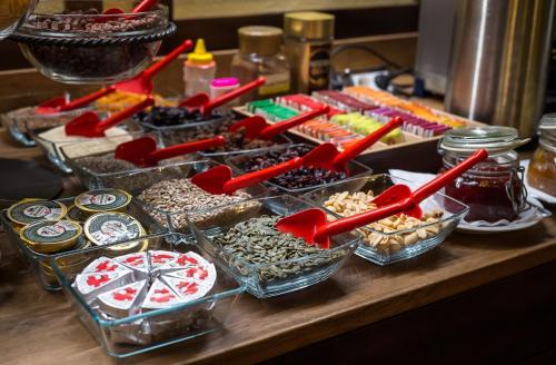 a table with a bunch of different types of desserts at Hotel U Malého Vitka in Český Krumlov