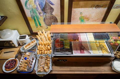 a display case with a bunch of different types of food at Hotel U Malého Vitka in Český Krumlov