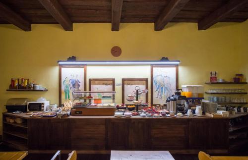 a kitchen with a counter with food on it at Hotel U Malého Vitka in Český Krumlov
