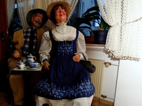 a statue of a woman in a blue dress at Landgasthaus Waldesruh in Welschneudorf