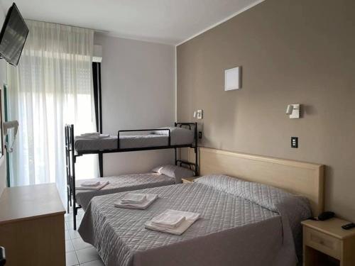 A bed or beds in a room at Hotel Rex