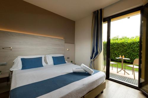Ένα ή περισσότερα κρεβάτια σε δωμάτιο στο Hotel Arena