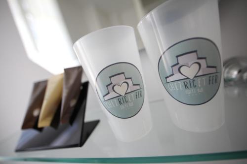 a couple of stickers on a glass table at Chez Ric et Fer in Coucy-le-Château-Auffrique