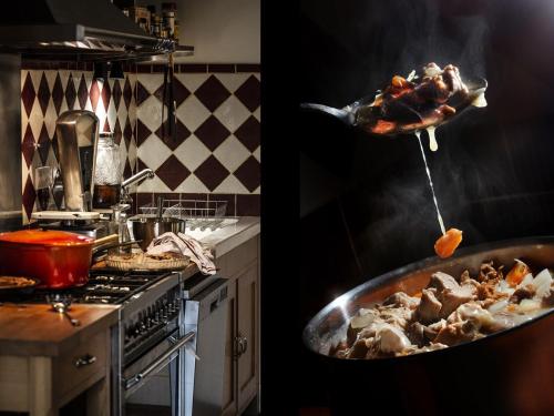 a kitchen with a pan of food on a stove at Villa Colombier in Pontgibaud