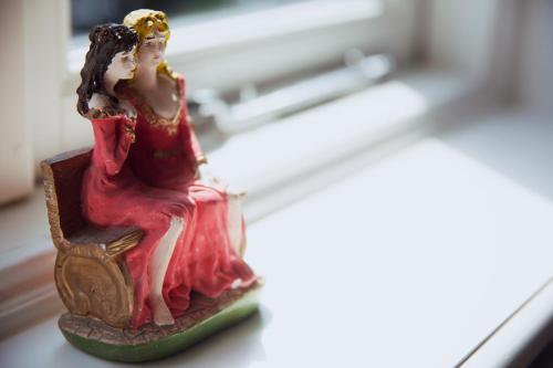 a figurine of a woman sitting on a chair at MUZE Hotel Utrecht in Utrecht