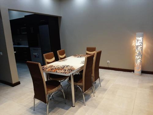 a dining room with a table and chairs at WHITE SHARK RESORT in Ponta do Ouro
