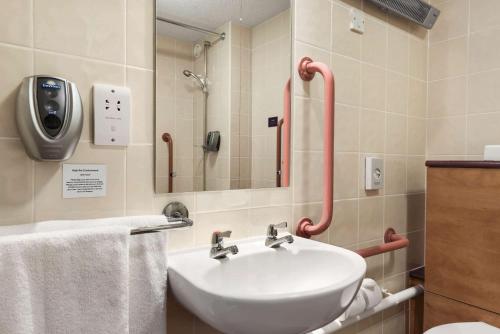 a bathroom with a sink and a shower at Days Inn Cannock - Norton Canes in Cannock