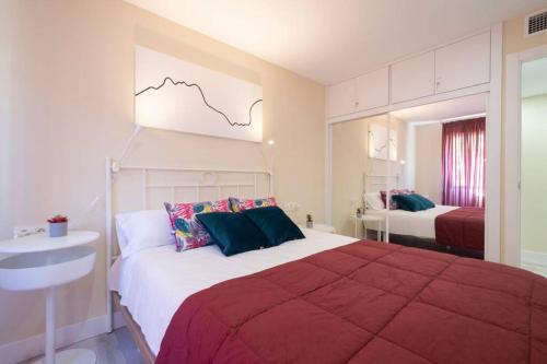 Impresionante apartamento Palacio de Congresos tesisinde bir odada yatak veya yataklar