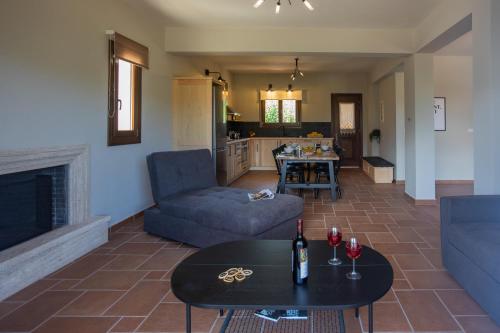 a living room with a couch and a table at Citrus House in Razáta