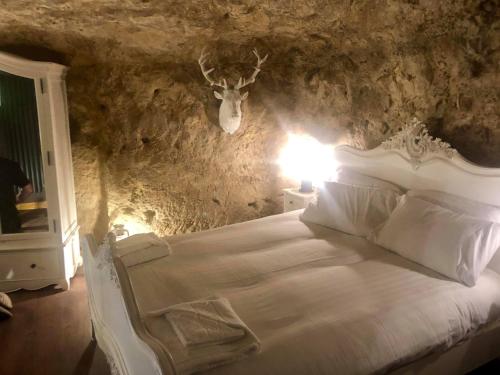 A bed or beds in a room at The Grotto