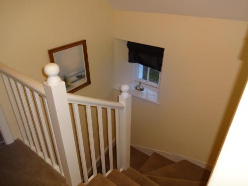 a stairway with a window and a stair case at Hillside in Kyleakin