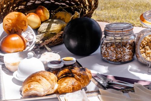 a table topped with lots of different types of bread at Agroturismo Can Pere Sord in Sant Joan de Labritja