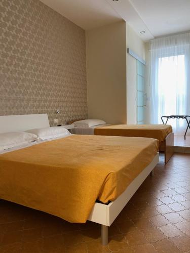 Postel nebo postele na pokoji v ubytování Acquaviva Experience B&B