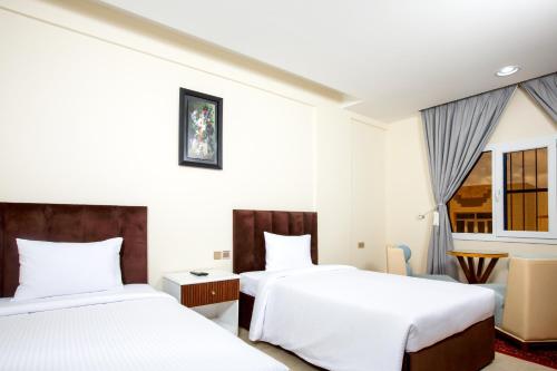 Llit o llits en una habitació de Al Asala Resort