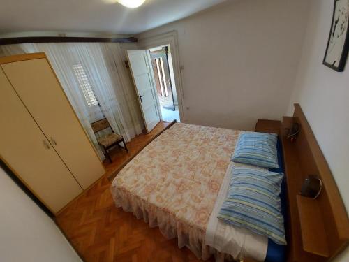 a bedroom with a large bed in a room at Apartment Boris in Labin