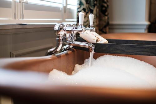 a sink filled with a pile of white powder at Bear Of Burton in Christchurch