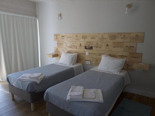 Ένα ή περισσότερα κρεβάτια σε δωμάτιο στο D'Vine - Country house
