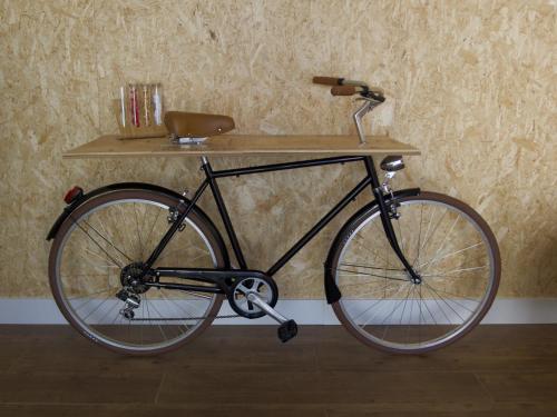 a bike parked next to a wall with a shelf at D'Vine - Country house in Cartaxo