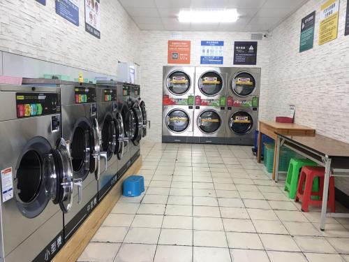 two washers and dryers in a laundromat at Taimali Hotel in Taimali