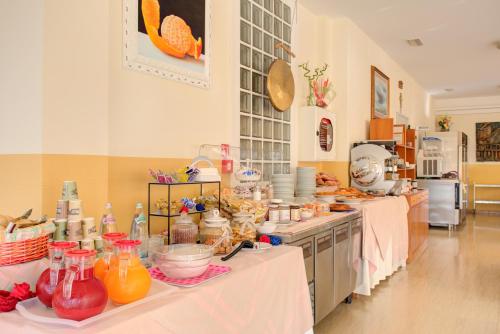 Kuchyň nebo kuchyňský kout v ubytování Hotel Nella