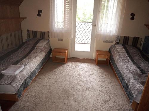Cama o camas de una habitación en Borostyán Vendégház Dunasziget