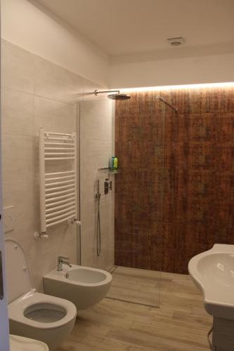 a bathroom with a shower and a toilet and a sink at Casa Vacanze Chery in Sorrento