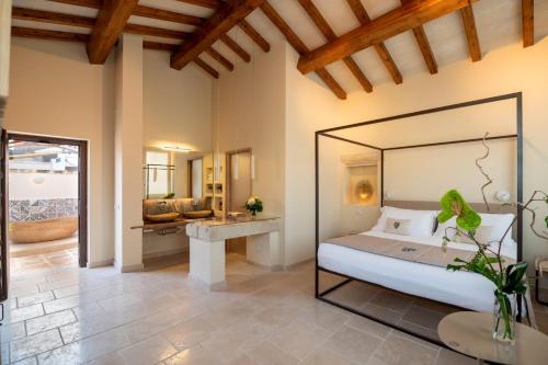 Postel nebo postele na pokoji v ubytování Pollicastro Boutique Hotel
