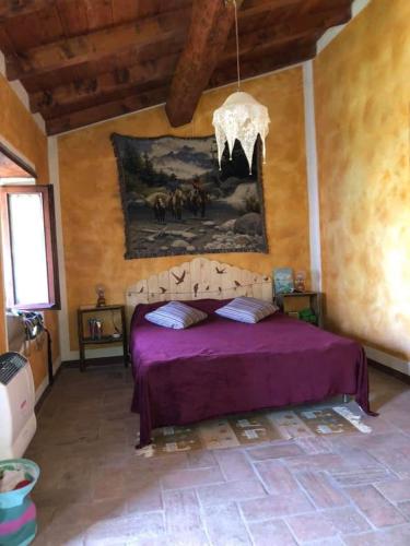 Postel nebo postele na pokoji v ubytování Bed and Breakfast Balli coi Lupi