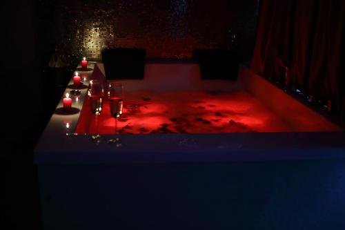 a table with red lights on it in a dark room at MELISS EVENTS in Craiova