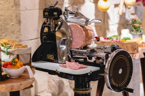 a mixer sitting on top of a table with food at Pollicastro Boutique Hotel in Lecce