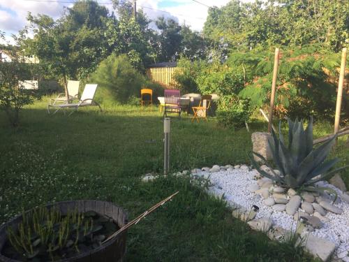 a garden with a pineapple in the yard at Accacia Home in Ferrières