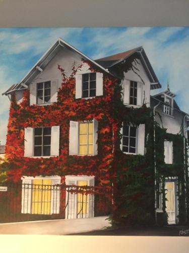 a painting of a house covered in ivy at La Bergerie in Le Pouliguen