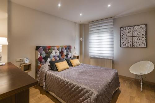 Ένα ή περισσότερα κρεβάτια σε δωμάτιο στο Casa Lakuntza