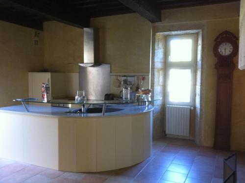 a kitchen with a counter top and a window at gite des rois ducs in Sauveterre-la-Lémance