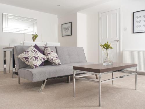 a living room with a couch and a coffee table at Marischal Apartments in Aberdeen
