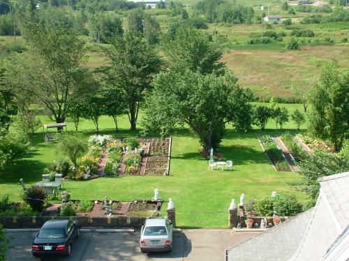 a view of a park with cars parked in a parking lot at Marshlands Inn in Sackville