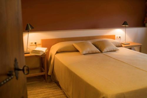 מיטה או מיטות בחדר ב-Mas Vermell