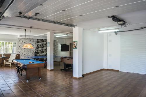 a large room with a pool table in it at Villa Casa Kenaz in El Campello