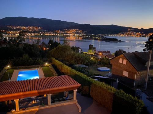 a view of the water from the roof of a house at Playa America! in Nigrán