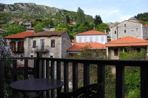 a view of a town from a balcony at Tsarbou Guesthouse in Stemnitsa